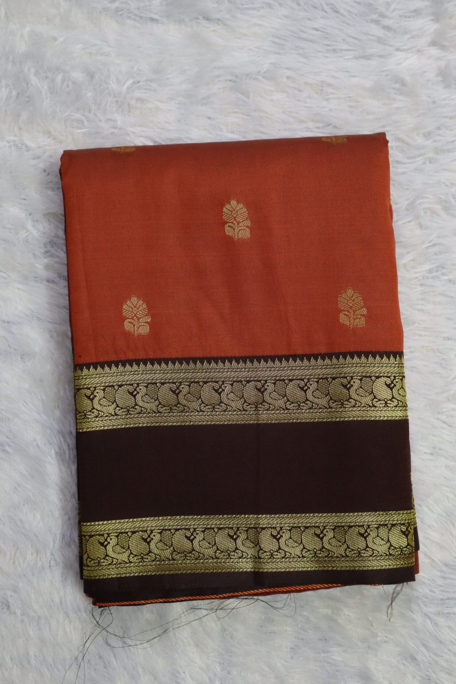Premium Semi Kanchipuram soft silk saree in rust orange and brown with golden flower butta from Style with Diti